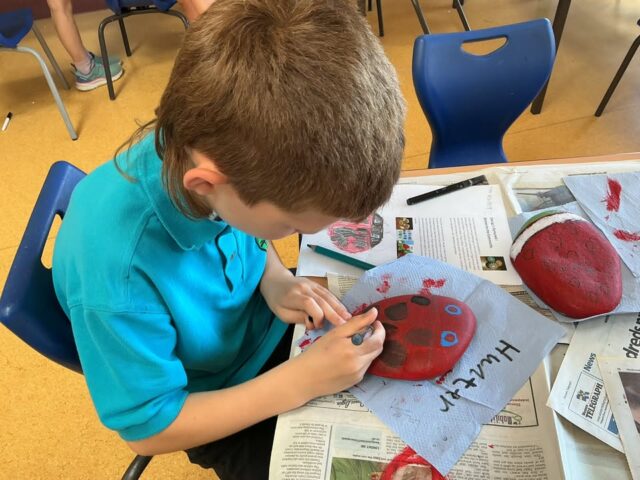 Pupils at school have been busy painting stones as part of a fun activity to spread kindness, happiness and creativity in our community. These stones will be hidden in a safe and interesting location within the local area. We would encourage you to find tgese stones as you go for a wslk in the locality. If you find one, the QRCode on the back will explain what we would like you to do. This is a community activity to encourage a little walking, fitness and sharing dome happiness with others. Enjoy finding our stones and have some fun doing so😀.